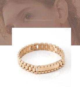 Detail of rose gold stainless steel watch strap bracelet with secure folding clasp