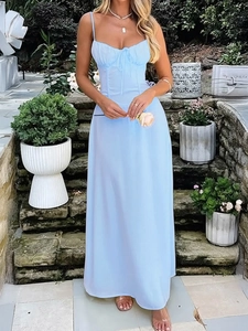 Detailed view of elegant light blue summer dress with thin straps and flowing A-line skirt
