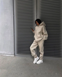 Close-up of oatmeal loungewear set featuring a cozy oversized hoodie and matching joggers
