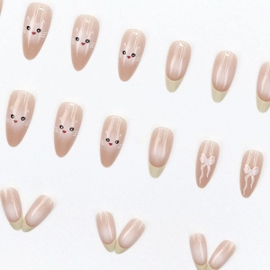 French almond press-on nails set featuring cute cat faces and white ribbon bow designs