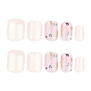 Short square press-on nails in cream white with floral art designs and gold foil accents
