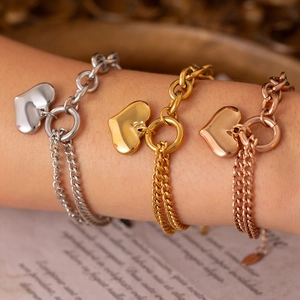 Asymmetric heart pendant bracelet in gold, silver, and rose gold stainless steel