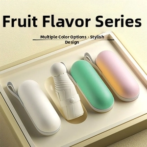 Three compact five-fold travel umbrellas in pastel colors with capsule cases and carrying loops