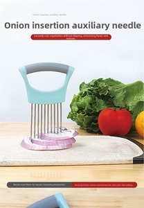 Detail showing stainless steel onion holder slicing aid on marble cutting board