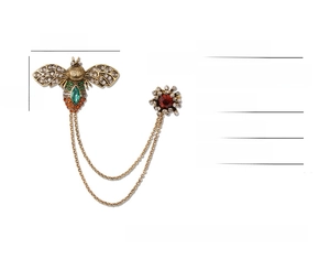 Detail view of vintage bee brooch with colorful rhinestones and gold chains measurement