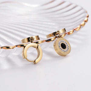 Golden Roman numeral hoop earrings with black circular stone and pave crystal accents
