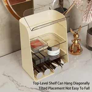 Cream multi-tier cosmetic organizer with clear dustproof cover on marble counter