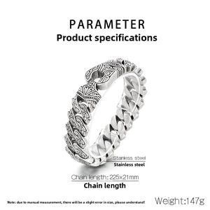 Detail showing the heavy vintage stainless steel chain link bracelet with Celtic totem engraving