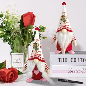 Detail of Valentine gnomes with love hearts and cupid patterns on white hats