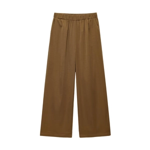 Flat lay of brown wide-leg trousers featuring an elastic waist and side pockets