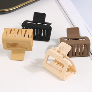 Set of four matte square hollow hair claws in black, brown, khaki, and beige colors