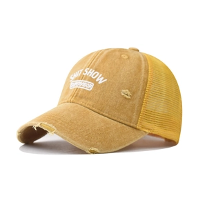 Detail of mustard yellow distressed trucker hat with SHIT SHOW SUPERVISOR print