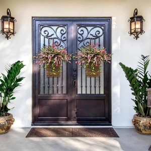 Detailed close-up of pink berry wildflowers in hanging rattan baskets for home door decor