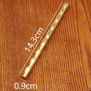Detailed view of bamboo-shaped gold brass pen with 14.3cm length and 0.9cm diameter