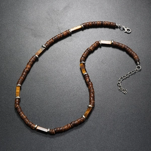 Detail of brown coconut wood beads and tiger eye stone necklace with lobster clasp