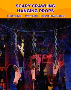 Detailed view of bloody severed hand and foot props with metal hooks for haunted house decor