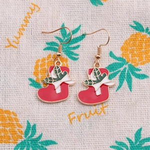 Cute red enamel Christmas stocking earrings with festive green holly and golden hooks