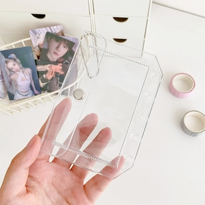 Handheld view of transparent PVC 6-hole card holder with metal chain and snap button