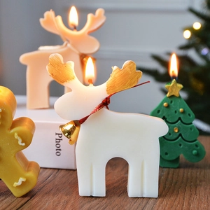 Christmas scented candles set featuring reindeer, gingerbread man and pine tree decor