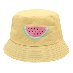 Detail of kids reversible bucket hat with bright yellow canvas and cartoon watermelon print