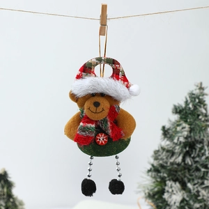 Detail of Christmas bear ornament with red plaid hat and green felt body on a tree