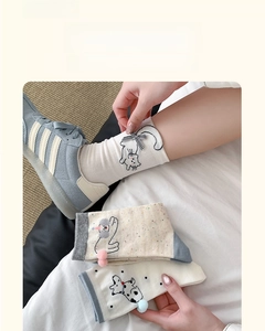 Detailed view of breathable cotton mid-calf socks with cute cartoon animal patterns
