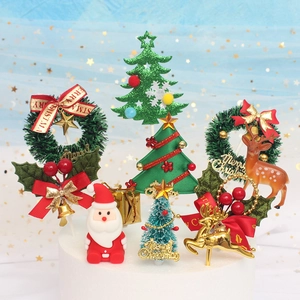 Detailed Christmas cake toppers with Santa, reindeer, and wreaths in a festive scene