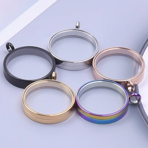 Five round stainless steel floating locket pendants in black silver gold and rainbow colors
