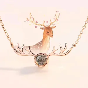Detailed view of rose gold deer antler necklace with creative projection stone center