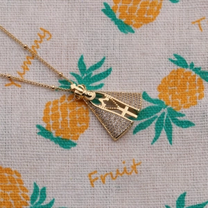 Gold-plated religious necklace featuring a Madonna and cross pendant with cubic zirconia
