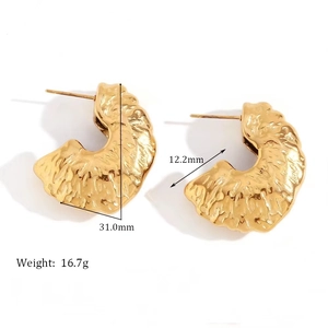 Detailed view of hollow C-shaped hammered gold earrings showing 31mm size measurements