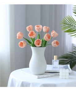 Pink PU tulips in white ribbed ceramic vase for elegant home decor tabletop arrangement