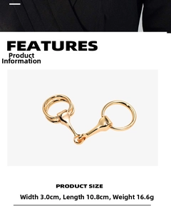 Detail view of golden horsebit buckle with dimensions 3.0cm width and 10.8cm length