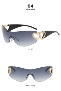 Detail view of Y2K wrap-around sunglasses with golden double heart metal ornaments