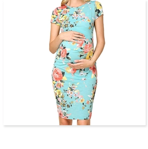 Detail of short sleeve maternity dress featuring pleated floral print on light blue fabric