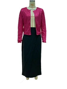 Detail of fuchsia sequin crop jacket with vertical stripes and black long skirt