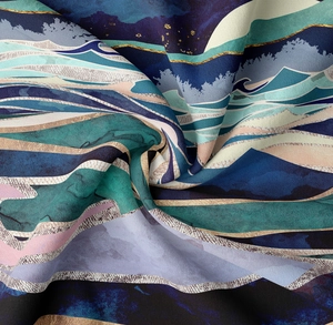 Detail of mountain art tapestry with abstract blue and gold flowing fabric patterns