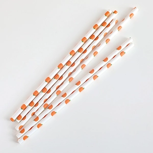 Eco-friendly paper straws with orange pumpkin patterns for Thanksgiving party decor