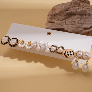 Macro detail of 12-piece retro pearl earring set featuring floral and heart designs