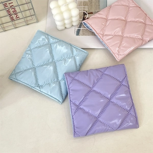 Quilted glossy faux leather storage bags in blue, pink, and lilac with a square design