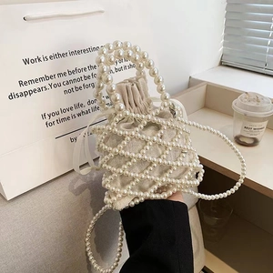 Elegant white beaded bucket bag with drawstring pouch and long shoulder strap