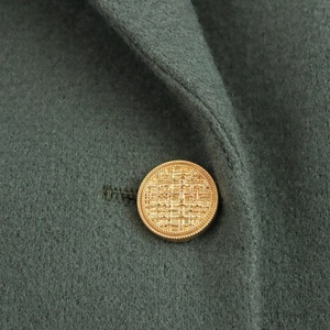 Women's vintage dark green wool coat with double-breasted buttons and notched lapel