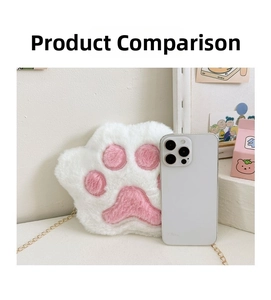 Size comparison of a white plush bear paw bag with a smartphone and metal chain