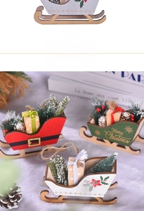 Detail of wooden Christmas sleigh ornaments with pine cones and miniature gift boxes