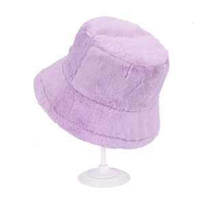 Detail view of purple cashmere fisherman hat with soft faux fur texture on a white stand