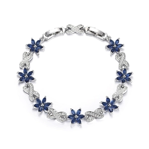 Close-up of S925 silver bracelet featuring blue zircon flowers and infinity symbols