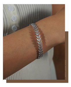 Detailed view of an adjustable silver leaf bracelet showing intricate leaf vein textures