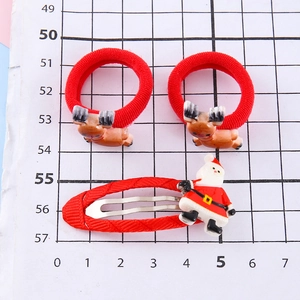 Christmas hair clips set featuring red reindeer antlers and Santa Claus for girls