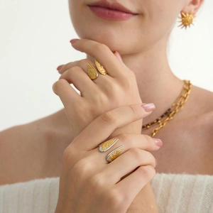 18K gold plated stainless steel angel wing adjustable open ring worn by a model