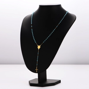 Vintage oval portrait medallion necklace with blue beads and gold cross pendant